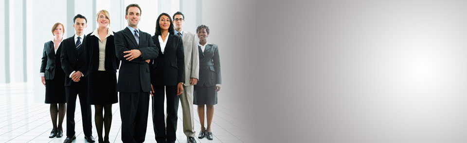 group of seven employees in nice dress clothes ready for their IT outsourcing jobs at SSI